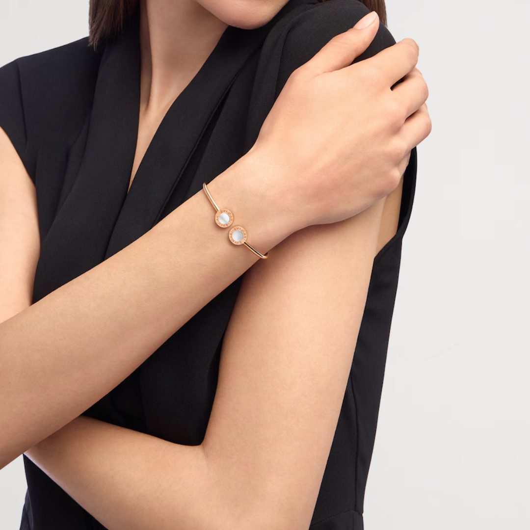 Bvlgari Bvlgari Rose Gold and Mother-of-Pearl Bracelet copy Model wearing a Bvlgari Bvlgari Mother-of-Pearl Bracelet fake in 18K rose gold for daily wear and stacked bracelet styling.